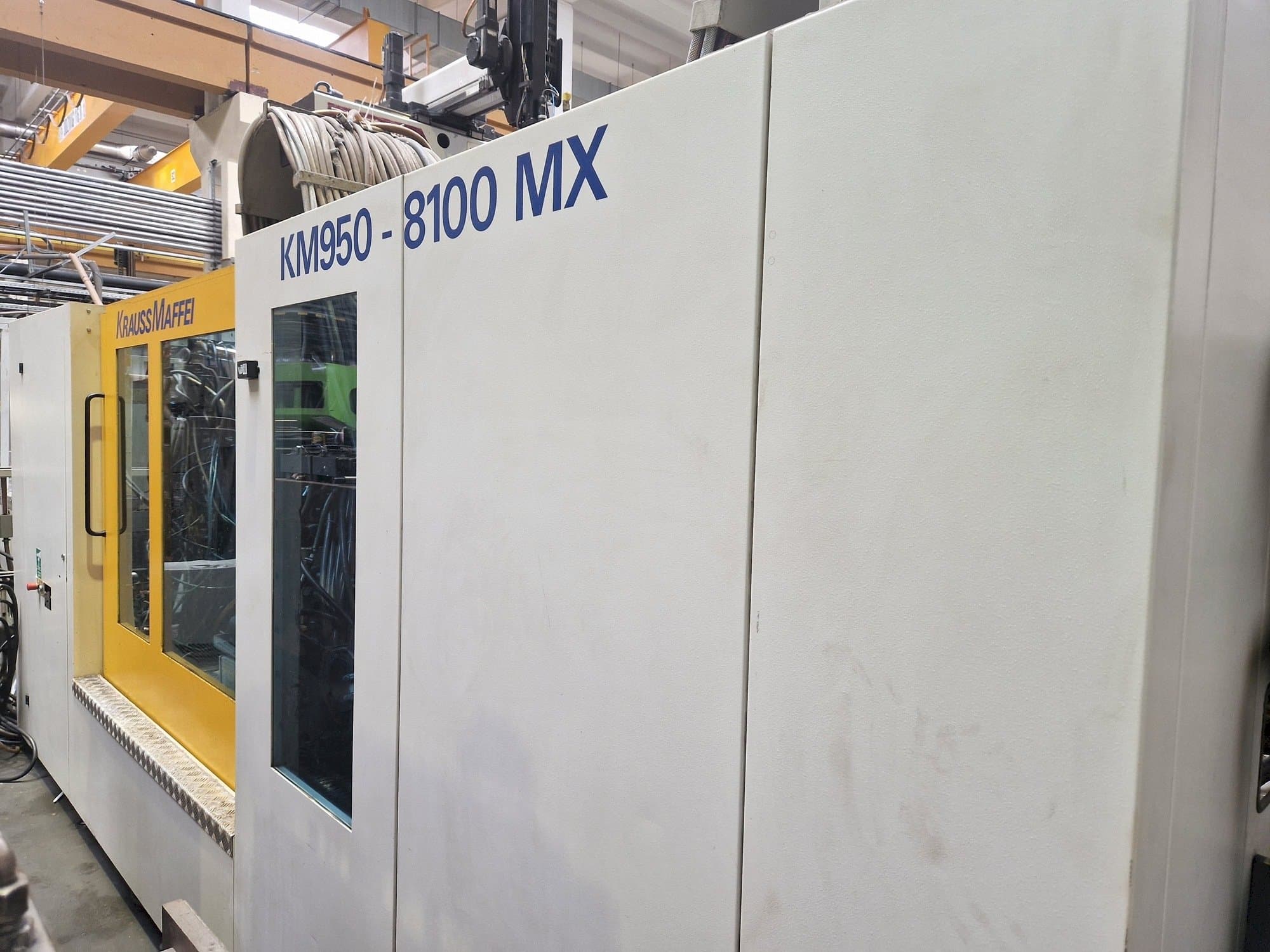 Prikaz  stroja Krauss Maffei 950-8100 MX  sprijeda