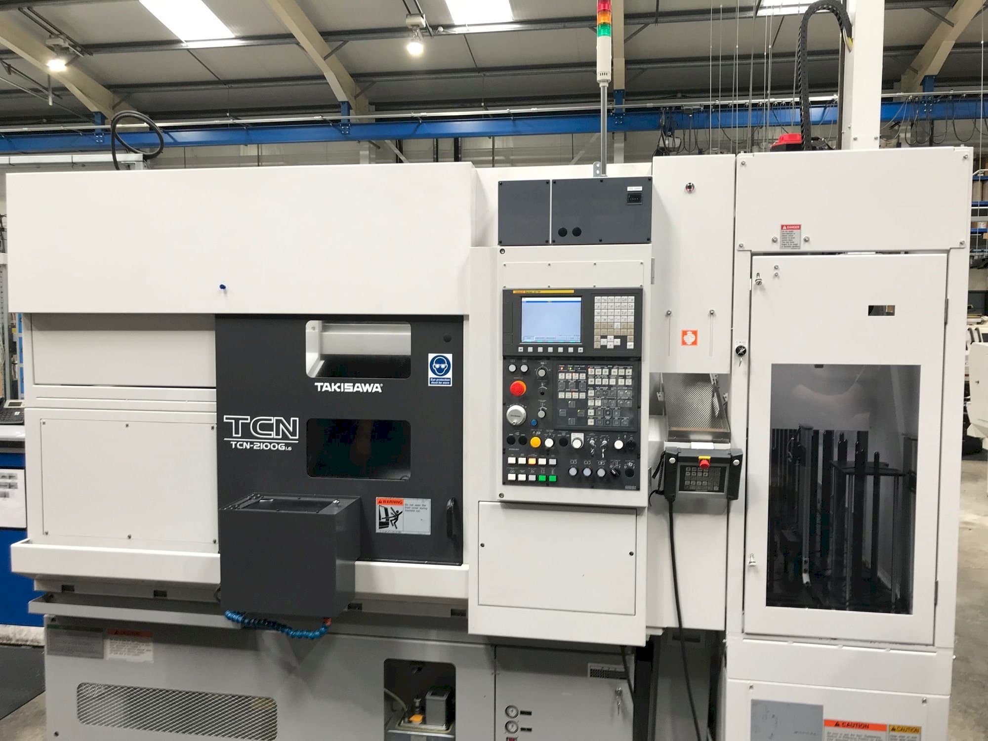 Prikaz  stroja Takisawa TCN-2100G L6  sprijeda